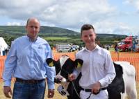 Jack Nevin and Daniel McKay with Jonny Lyons' 1st placed heifer calf