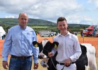 Jack Nevin and Daniel McKay with Jonny Lyons' 1st placed heifer calf